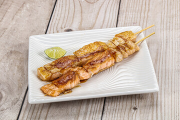Grilled salmon skewer with sauce