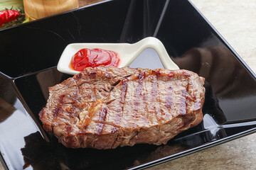 Grilled rib-eye steak beef meat