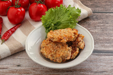 Fried salmonn cutlet in the bowl