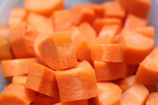 slices of carrot. chopped unpeeled carrot. carrot with selective focus. peeled and chopped natural orange food.