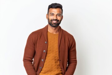 Obraz premium Lifestyle portrait of an Indian man in his 30s against a white background