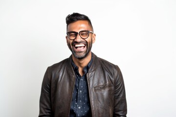 Obraz premium Lifestyle portrait of an Indian man in his 30s against a white background