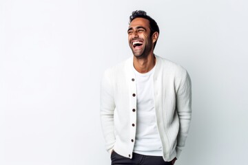 Obraz premium Lifestyle portrait of an Indian man in his 30s against a white background