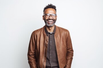 Obraz premium Lifestyle portrait of an Indian man in his 40s against a white background