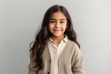 Obraz premium Lifestyle portrait of an Indian child female in a minimalist background