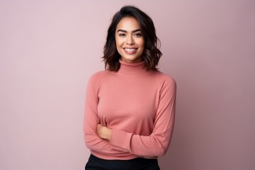 Medium shot portrait of an Indian woman in her 30s in a minimalist background