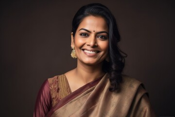Group portrait of an Indian woman in her 30s wearing sherwani in a minimalist background