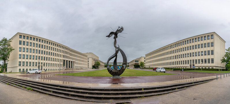 Caen, France - 07 27 2023: View of the campus University of Caen Normandy, the buildings building and the sculpture the phoenix from Esplanade of Peace.