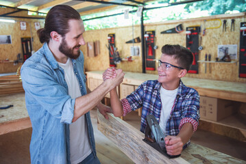 Father and son working with wood