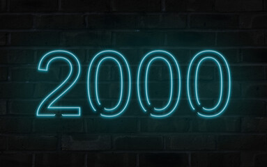 Blue 2000 neon sign on a brick wall
