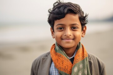 Close-up portrait of an Indian child male in a beach 