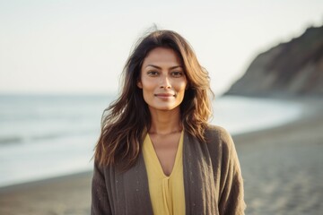 Group portrait of an Indian woman in her 30s in a beach 