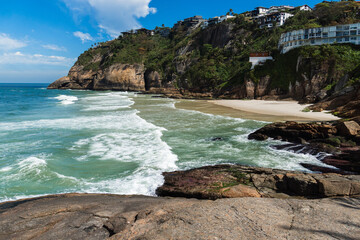 Joatinga Beach, a paradise in Rio de Janeiro, Brazil. Sunny day in the morning. Emerald green sea with good waves for surfers. Mountains and hills around and a lot of nature
