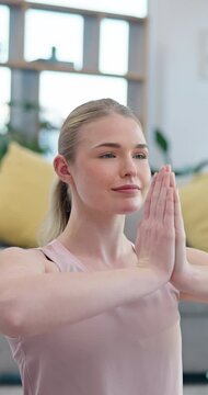 Yoga, meditation and prayer pose, woman in home, chakra health and mindfulness training in living room. Balance, calm breathing and workout, girl in holistic exercise for peace and zen in apartment.