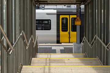 train waiting at a station stairs downhill