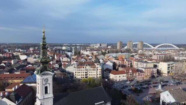 Aerial of a clock tower of a church in Linz city, Austria with the cityscape in the background