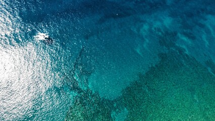 Aerial view of a tranquil turquoise sea on a sunny day