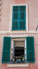 Building with a unique aesthetic, featuring green shutters.