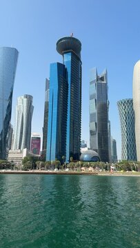 Vertical footage of Doha Tower and buildings coast by West Bay, Doha, Qatar