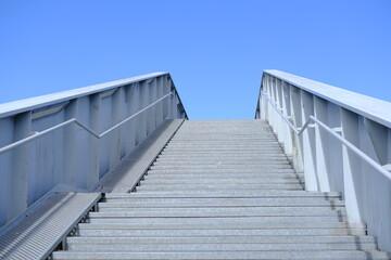 Fototapeta premium nantes, france - august 19, 2023. A stair case with a blue sky in the background.