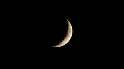 Obraz na płótnie Canvas Stunning view of a crescent moon against a dark night sky