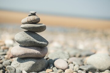Small pebble tower on the rocky beach. Zen, harmony.