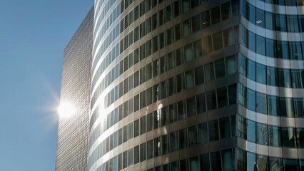 Fototapeta na wymiar High-rise building illuminated by the bright sunlight