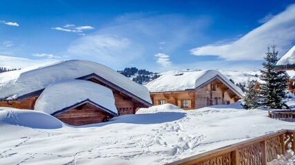 Cozy winter scene a rustic cabin with a thick blanket of snow on its roof