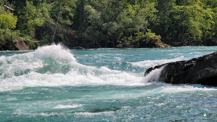 River Gorge Rapids. Niagara Falls, Canada with lush green vegetation in the background