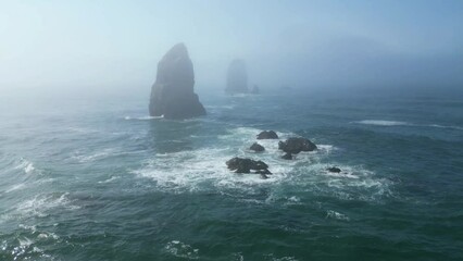 Beautiful view of massive rock formations in the middle of the sea on Canon Beach