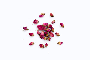 Dried roses for tea on white background.