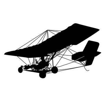 Silhouette of an ultralight aircraft with a person piloting it