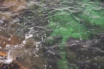Sea view from above coastline with underwater rocks in Syracuse, Sicily, Italy.