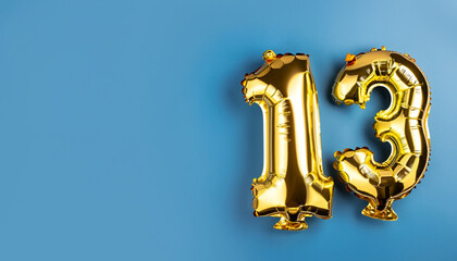 Banner with number 13 golden balloon with copy space. Thirteen years anniversary celebration...