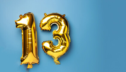 Banner with number 13 golden balloon with copy space. Thirteen years anniversary celebration...