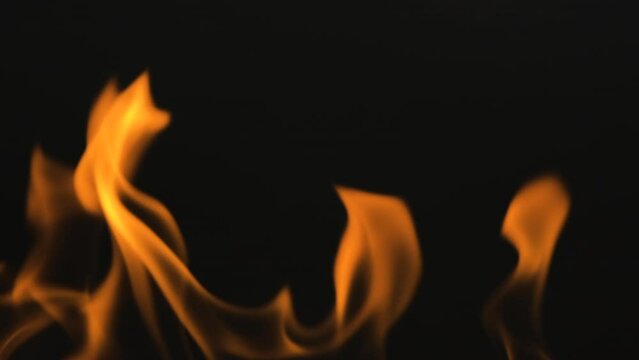Fire line or flames isolated on black background. Full HD slow motion resolution video of Fire that is burning on black wall background.