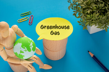 There is notebook with the word Greenhouse Gas. It is as an eye-catching image.