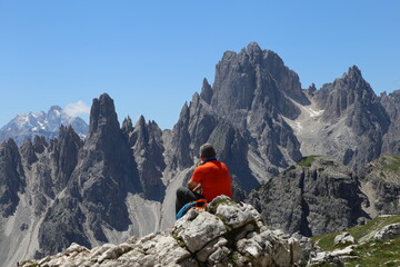 Hiker enjoying the view in Dolomites 