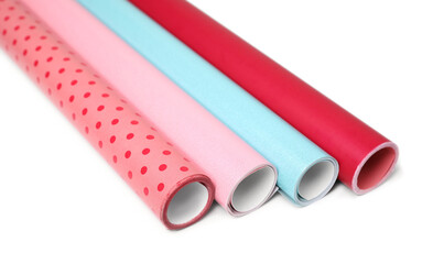 Rolls of colorful wrapping papers on white background