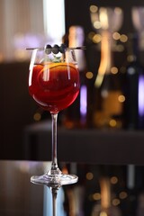 Glass of delicious refreshing sangria on counter in bar
