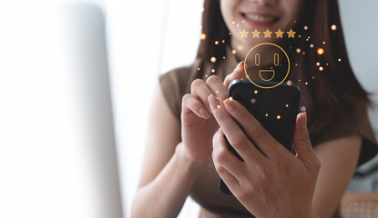 Customer experiences and review concept. Happy woman client using smartphone to review five star...