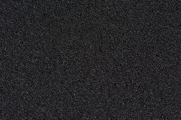 Black soft foam board background. black sponge surface texture. - obrazy, fototapety, plakaty