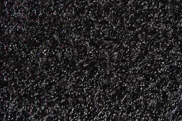Fototapeta premium Black soft foam board background. black sponge surface texture.
