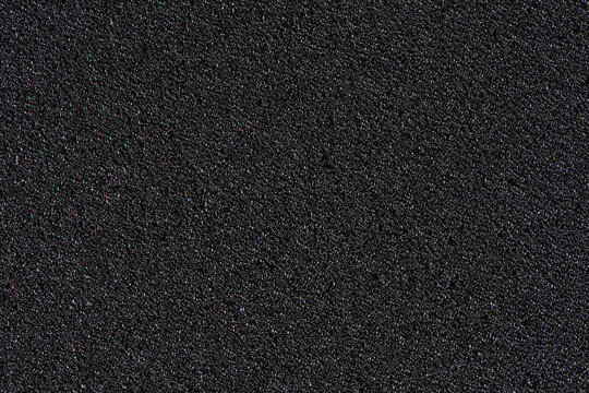 Black soft foam board background. black sponge surface texture.