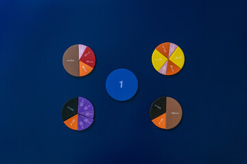 Сolorful math fractions on blue background. interesting math for kids. Education, back to school...