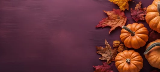  top view fall halloween still life with pumpkin and leaves with copy space, Vibrant autumn pumpkins and leaves on a purple background. Fall harvest design template © AlexTroi