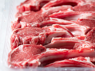 Set of fresh raw lamb ribs in takeaway pack