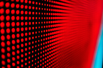 Bright colored blue LED wall with pink pattern - close up background.
