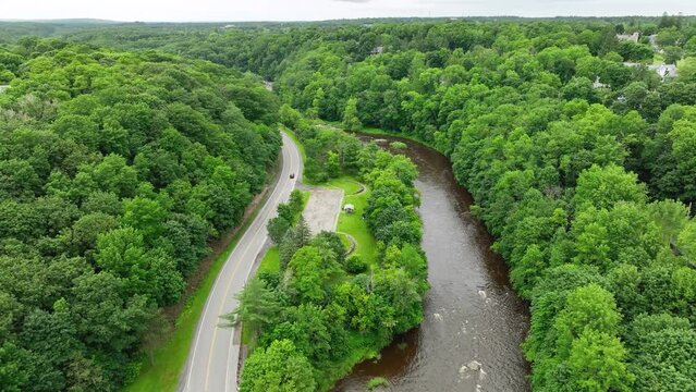 Aerial view of the Penobscot River flowing through Bangor, Maine's countryside.