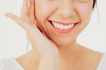Asian woman with beautiful teeth : Closeup young woman's face with healthy teeth white clean...